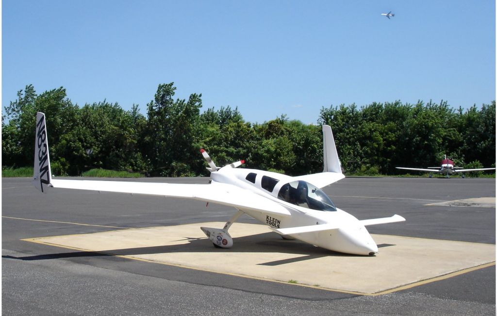 Experimental  (N83MZ) - Catching some Tarmac time is this 2002 Experimental Zeitlin Marc J. Cozy MK-IV posted in the Spring of 2019.  Think the front wheel is retracted to keep it in place.