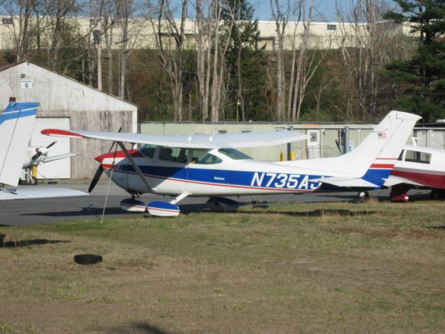 Cessna Skylane (N735AJ) - Sitting in front of Twin City Airmotive.