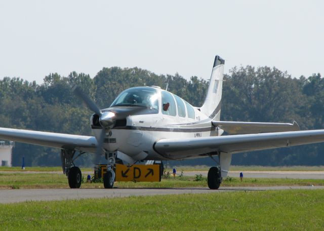 Beechcraft Bonanza (33) (N7BY) - Taxiing to 14 at Downtown Shreveport.