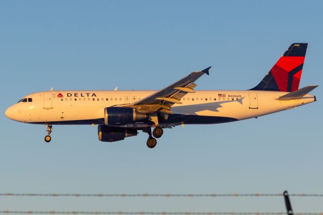 Airbus A320 (N326US) - Delta 2537 is coming into land 14 minutes ahead of schedule from Atlanta in some gorgeous golden hour lighting! Photo taken February 4, 2022 at 5:20 PM with Nikon D3200 at 86mm.