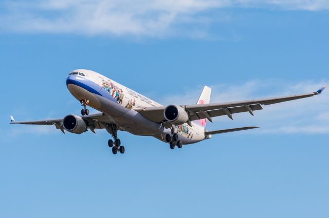 Airbus A330-300 (B-18358) - I was trying out the new 300mm lens at Christchurch Airport, when this China Airlines Airbus arrived from Sydney. Photographed on very short finals for Runway 02, in a stiff easterly wind.