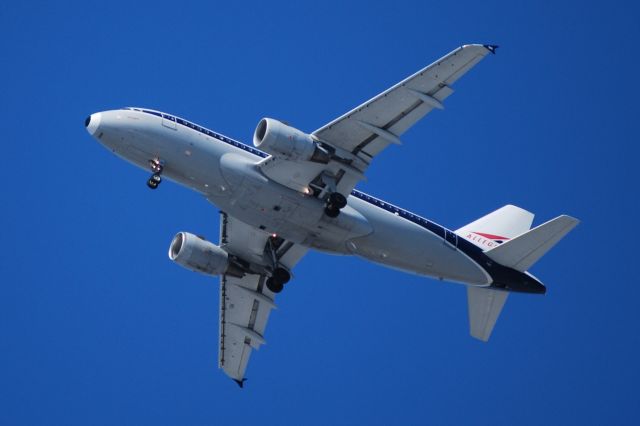 Airbus A319 (N745VJ) - On approach 5 miles from touchdown to 22L JFK US Air A319 in old Allegheny Colors
