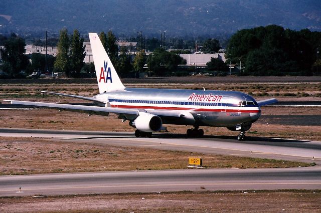 BOEING 767-200 (N304AA) - KSJC - N304AA turns off 30L at San Jose and heads to the gate. AA ran some 767-200 flights for a short time in the mid 1990s. I never took the time to find out where they were flying too.