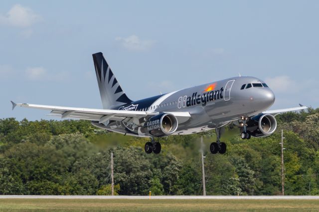 Airbus A319 (N328NV) - Allegiant 3004 crosses the threshold of DSM's Runway 13 completing a flight from Las Vegas Harry Reid International Airport wearing the gorgeous Las Vegas Raider Livery! Photo taken September 19, 2021 at 11:58 AM with Nikon D3200 at 220mm.