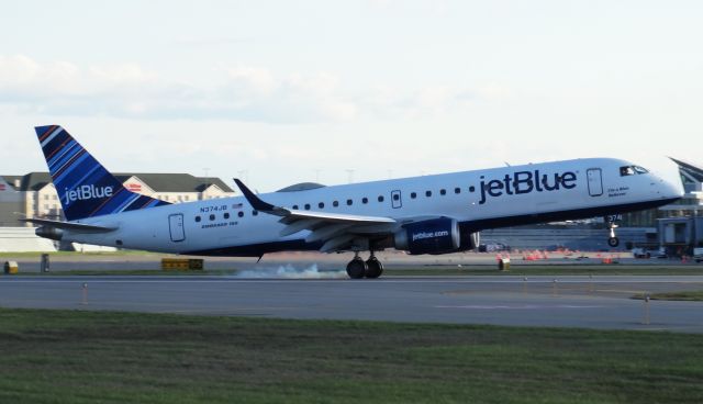 Embraer ERJ-190 (N374JB) - Touchdown shot! Smokey wheels on a  E190 landing on runway 32