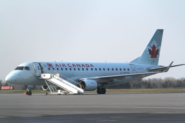 Embraer 170/175 (C-FFYG) - An Embraer 175 chartered to Leonard Cohen awaits his arrival at Kingston Airport..