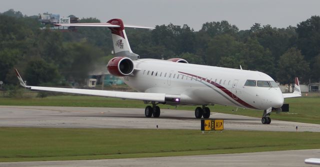 Canadair Regional Jet CRJ-700 (N519JG) - A Joe Gibbs Racing Canadair CL-600-2C10 (CRJ7) about to enter the ramp at Anniston Regional Airport, AL - October 12, 2017.