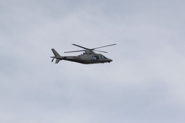 Grumman AA-5 Tiger (N109AG) - AgustaWestland AW109 (N109AG) flies over Sarasota