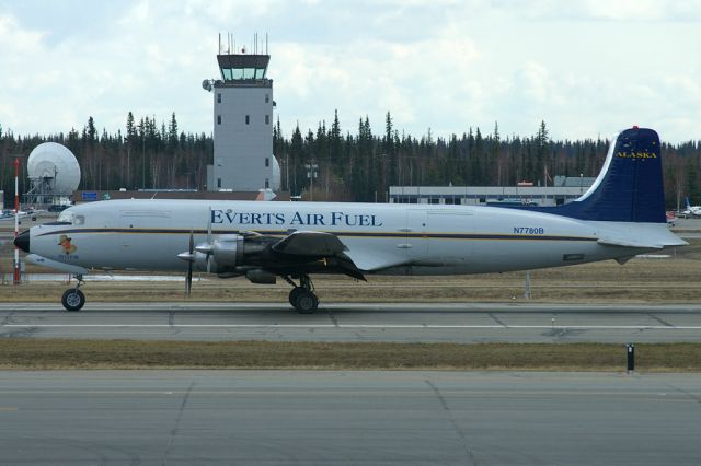 Douglas DC-6 (N7780B) - Everts Air Fuel DC6 seen taxiing at PAFA. Nose art is of a likeness of Howard Hughes with the title Aviator.