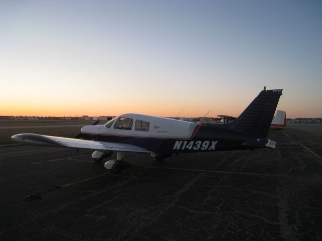 Piper Cherokee (N1439X) - My airplane sitting on the tie-downs at West Houston Airport at sunset.