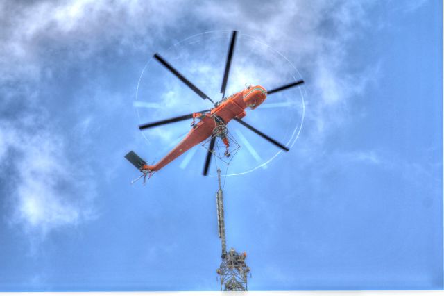 Sikorsky CH-54 Tarhe (N163AC) - This was very cool. We had the Air Crane lift our new UHF TV antenna to the top of our 1868 ft tall tower near Orlando FL. You can see the vapor trails streaming from the blade tips. The antenna weighed 14,000 lbs.