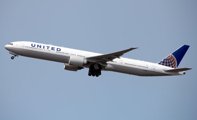 BOEING 777-300ER (N2748U) - Climbing from Rwy 34L