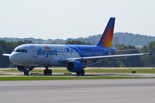 Airbus A320 (N218NV) - New "Make-a-Wish" livery taxiing at KJQF - 9/22/18