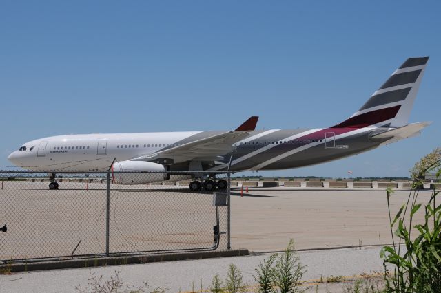 Airbus A330-200 (9H-CLX) - Getting closer to getting a half way decent shot. Thank You Comlux for pushing this back a bit from all the ramp clutter and fences. This was shot through a chain link fence.