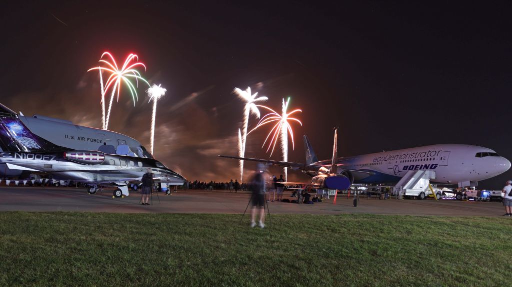 Embraer Phenom 100 (N100FZ) - My first trip to Airventure and some amazing fireworks Wednesday night, 27 Jul 2022. Here are some colorful bursts lighting up N861BC, the Boeing 777 ecoDemonstrator, 64-13270, USAF T-38A, N100FZ, an Embraer EMB-500, and 17-46037, a USAF KC-46 Pegasus. This was my first airshow with my new Canon EOS R6.