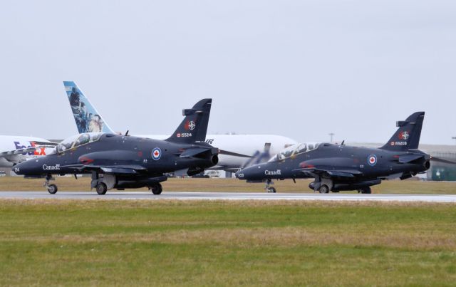 Boeing Goshawk (15-5214) - These two BAe CT-155 Hawks are departing rwy 25 to participate at this years Remebrance Day Flyby on 11-Nov-13.