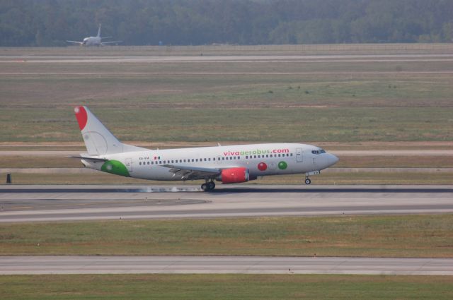 BOEING 737-300 (XA-VIA) - 737 touching down on 8R at IAH.