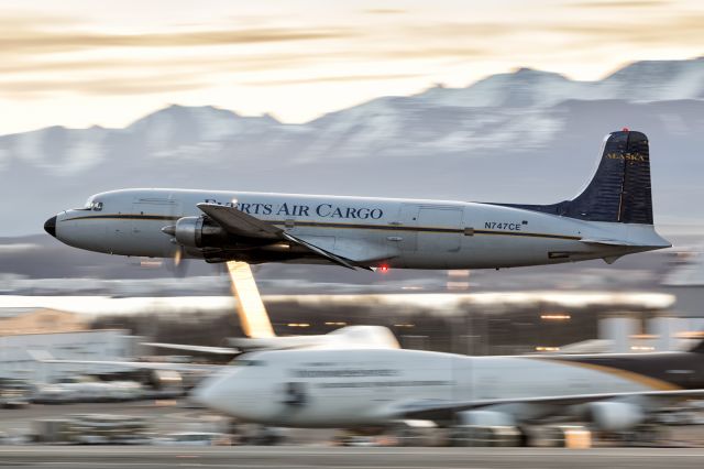 Douglas DC-6 (N747CE) - Everts Air Cargo morning departure out of Anchorage