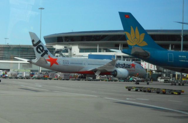 Boeing 787-8 (VH-VKA) - Taken from inside the airport transfer bus in Sydney from domestic to international