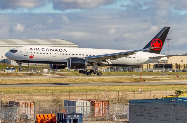 BOEING 777-200LR (C-FNNH) - Shutters clicking madly as AC7090 from KGUS arrives with some new clothes, first new livery on an AC 777