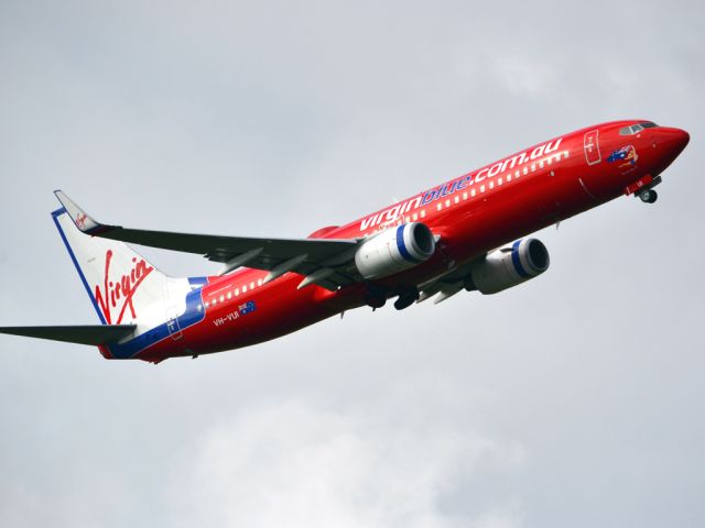 Boeing 737-700 (VH-VUI) - Getting airborne off runway 23 on a gloomy, cold winters day. Wednesday 4th July 2012.