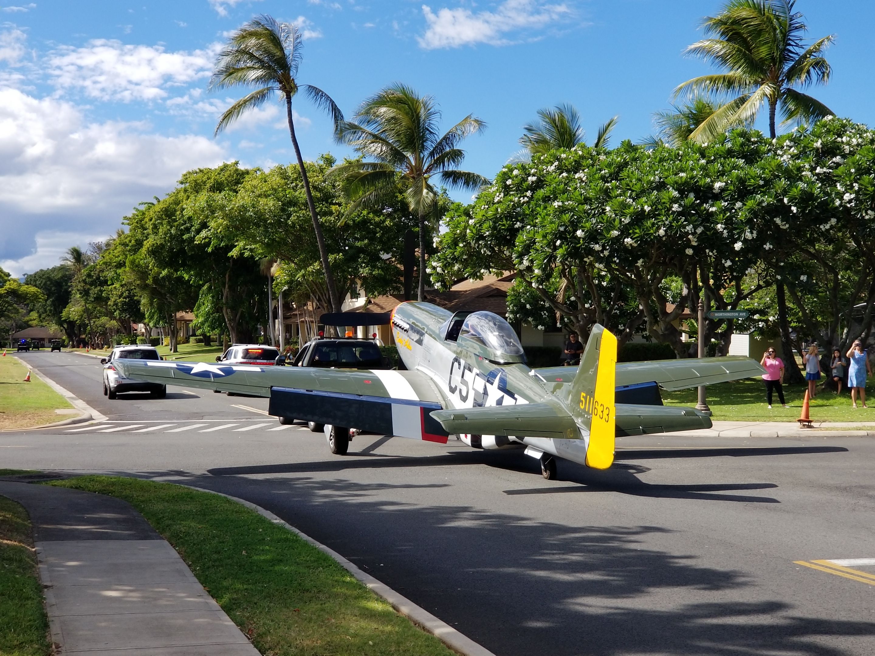 N151MW — - A P-51D named "Lady Alice" being transported from Hickam AFB to Pearl Harbor. "Lady Alice" was towed through base housing on Joint Base Pearl Harbor Hickam (JBPHH) with five other warbirds. This unusual land based parade of aircraft was to transport the aircraft back to the USS Essex after three weeks in and flying over O'ahu in support of the 75th Anniversary of VJ Day activities. "Lady Alice" and 13 other warbirds are being shipped back to the mainland aboard the USS Essex.