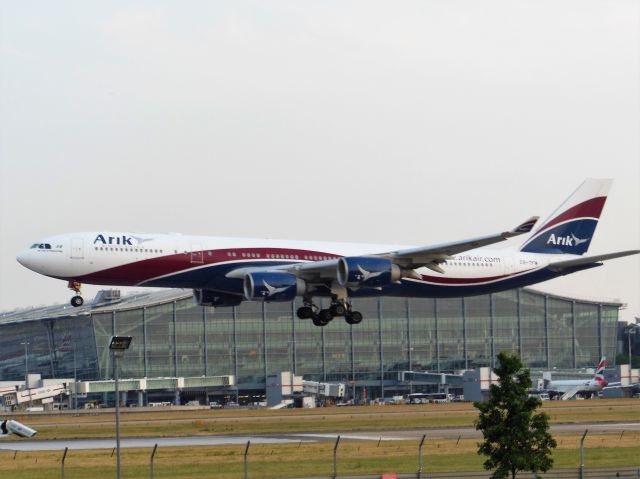 Airbus A340-500 (CS-TFW) - Arik Air (W3) CS-TFW A340-541 [cn910]br /London Heathrow (LHR). Arik Air flight W3101 arriving from Lagos Murtala Muhammed (LOS).  br /Taken from Viewing Area, T5 Thistle Hotel Bar, Bath Road (adjacent to runway 9L)br /2013 07 05  a rel=nofollow href=http://alphayankee.smugmug.com/Airlines-and-Airliners-Portfolio/Airlines/MIDDLE-EAST-AFRICAhttps://alphayankee.smugmug.com/Airlines-and-Airliners-Portfolio/Airlines/MIDDLE-EAST-AFRICA/a