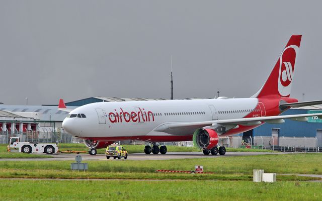 Airbus A330-200 (D-ALPF) - air berlin a330-223 d-alpf being towed into asl hanger at shannon 8/11/17.