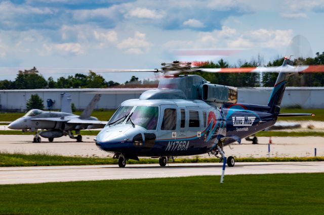 Sikorsky S-76 (N176BA) - AeroMed2 taxis at KGRR with an F-18C in the background