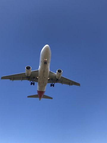 Airbus A319 (EC-KOY) - standing at the foot of the runway 10 by the road. EC-KOY coming into land