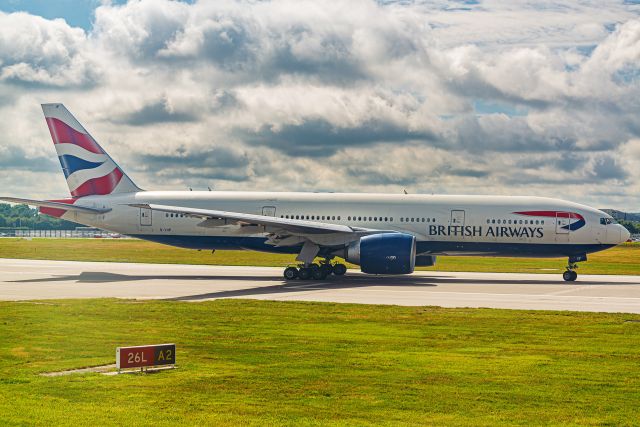 Boeing 777-200 (G-VIIP) - Taken around 4 years ago from the airplane window. Had a tough time with the haze from the window.