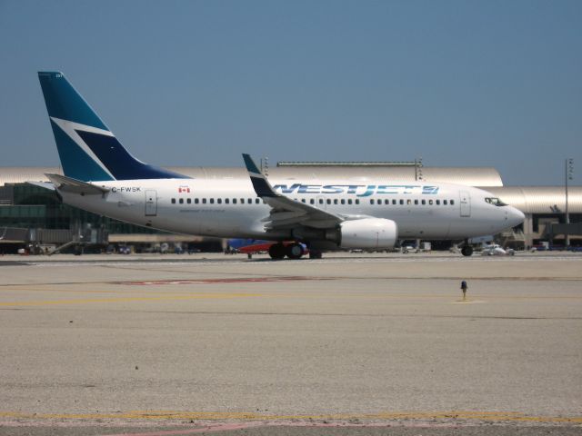 Boeing 737-700 (C-FWSK) - HOLDING ON RWY 19R