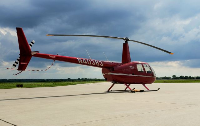 Robinson R-44 (N40363) - Scattered thunderstorm clouds moving around, not raining here though