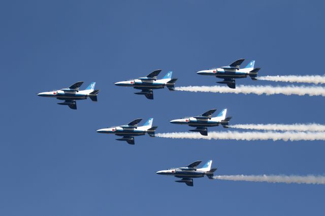 KAWASAKI T-4 — - 26 March 2016: Opening day of Hokkaido Shinkansen (Bullet- Train),Japan Air Self-defence Force, Blue Impulse made demonstrate flight for celebration above Hakodate City Hokkaido, Japan.