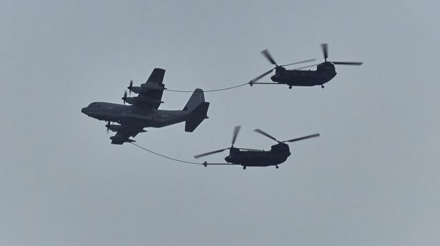 — — - A KC-130 gassin up a pair of MH-47G's