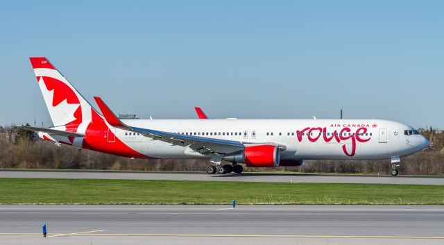 BOEING 767-300 (C-GHLT) - ROU1944 begins her take off roll on runway 33L and heads to El Dorado Intl, Colombia