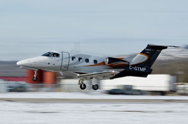 Embraer Phenom 100 (C-GYMP) - Take off at slave lake alberta in winter