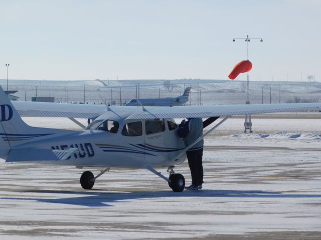 — — - ENY3767 Taxis to the gate after landing at KDBQ with N51UD sitting idle, watching from across the field.