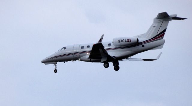 Embraer Phenom 300 (N304QS) - On final is this 2013 Embraer Phenom 300 in the Winter of 2019.