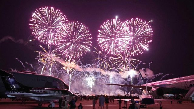 Boeing 777-200 (N861BC) - My first trip to Airventure and some amazing fireworks Wednesday night, 27 Jul 2022. Here are some colorful bursts lighting up N861BC, the Boeing 777 ecoDemonstrator, 64-13270, USAF T-38A, N100FZ, an Embraer EMB-500, and 17-46037, a USAF KC-46 Pegasus. This was my first airshow with my new Canon EOS R6.