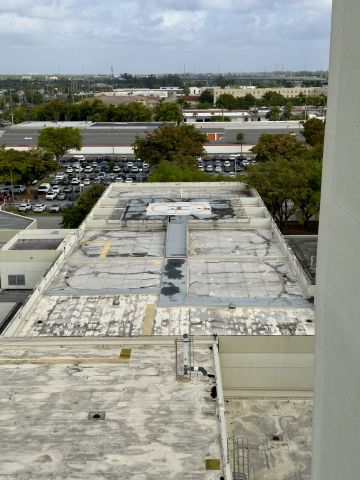— — - East-facing view of Helipad 1AF5 located on top of the Palmetto General Hospital ER Ambulance bay. 