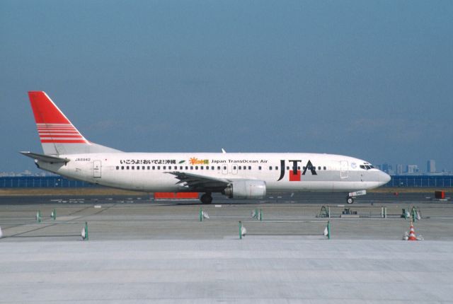 BOEING 737-400 (JA8940) - Taxing at Tokyo-Haneda Intl Airport on 2003/02/21 " Ikouyo! Oideyo! Okinawa Title "