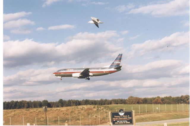 Boeing 737-700 — - USAir Boeing 737 about to touchdown on runway 33L at KBWI. Late 1996