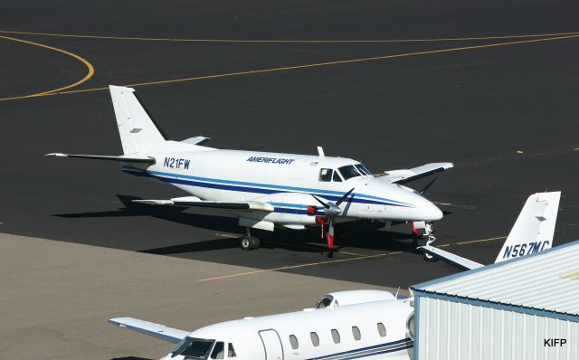 Beechcraft Airliner (N21FW) - KIFP - Ameriflight ready on the ramp. 1969 Beech B-99 Airliner C/N U-117