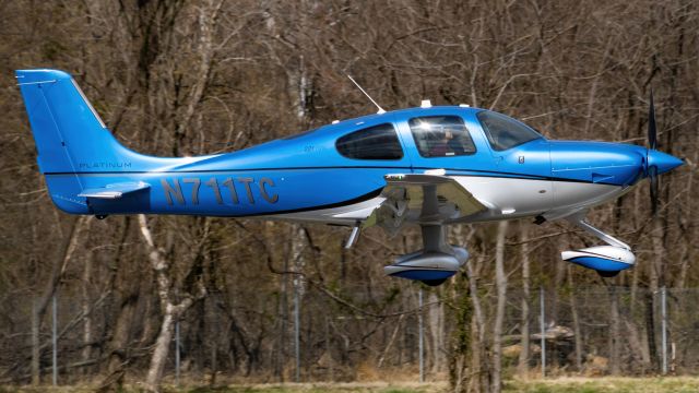 Cirrus SR-22 (N711TC) - A private Cirrus SR22 floating over a windy runway 15 at College Park Airport, seconds before going around 