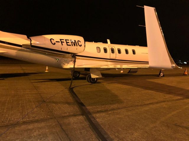 Learjet 40 (C-FEMC) - Parking on the GAT at Belfast International EGAA/BFS on a quick turn 