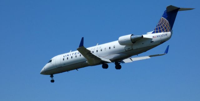 Canadair Regional Jet CRJ-200 (N930SW) - On final is this 2002 United Express Canadair Regional Jet 200LR from the Spring of 2021.