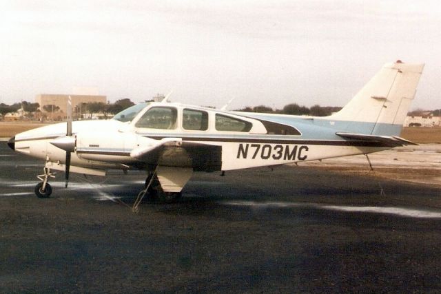 Beechcraft 55 Baron (N703MC) - Seen here in Jan-92.  Registration cancelled 26-Aug-14.