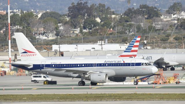 Airbus A319 (N745VJ) - Taxiing to gate at LAX