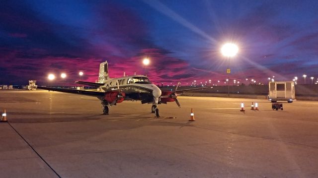 Beechcraft Queen Air (65) (N5079E) - Really red sunrise the morning of December 15th. Really stark contrast with the dark blue sky.